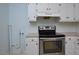 Kitchen with stainless steel range and white cabinetry at 5617 Laurel Crest Dr, Durham, NC 27712