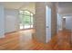 Living area with hardwood floors and brick wall at 5617 Laurel Crest Dr, Durham, NC 27712
