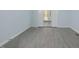 Open living area with gray tile floors and French doors at 5617 Laurel Crest Dr, Durham, NC 27712