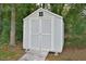 Grey shed with white trim and wooden walkway at 5617 Laurel Crest Dr, Durham, NC 27712