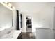 Bathroom features a single vanity and access to a walk-in closet at 601 Joe Gibson Dr, Gibsonville, NC 27249