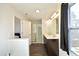 Bathroom with double vanity, shower, and walk-in closet at 601 Joe Gibson Dr, Gibsonville, NC 27249
