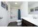 Bathroom with a shower/tub combo, double vanity, and dinosaur-themed shower curtain at 601 Joe Gibson Dr, Gibsonville, NC 27249