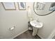 Stylish powder room with pedestal sink and modern decor at 601 Joe Gibson Dr, Gibsonville, NC 27249