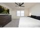 Main bedroom with a king-size bed, large TV, and ceiling fan at 601 Joe Gibson Dr, Gibsonville, NC 27249