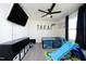 bedroom with a toddler bed, slide, and large TV at 601 Joe Gibson Dr, Gibsonville, NC 27249