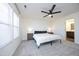 Main bedroom with king-size bed and ensuite bathroom access at 601 Joe Gibson Dr, Gibsonville, NC 27249