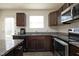 Modern kitchen with granite countertops and stainless steel appliances at 601 Joe Gibson Dr, Gibsonville, NC 27249