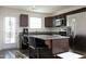 Modern kitchen with a granite island and stainless steel appliances at 601 Joe Gibson Dr, Gibsonville, NC 27249