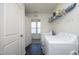 Laundry room with washer, dryer, and shelving at 601 Joe Gibson Dr, Gibsonville, NC 27249