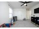 Bright playroom with toys, ceiling fan, and multiple doors at 601 Joe Gibson Dr, Gibsonville, NC 27249