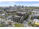 An aerial view of the condominium building highlights its prime location within a vibrant urban environment at 615 W Peace St # 307, Raleigh, NC 27605