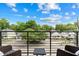 Spacious balcony with seating and a great view of the neighborhood at 615 W Peace St # 307, Raleigh, NC 27605