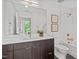 Bathroom featuring modern fixtures, and black and white tiled flooring at 615 W Peace St # 307, Raleigh, NC 27605