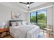 Inviting bedroom with a large window offering neighborhood views and modern ceiling fan at 615 W Peace St # 307, Raleigh, NC 27605