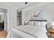 Comfortable bedroom featuring hardwood floors, ceiling fan, and neutral colors at 615 W Peace St # 307, Raleigh, NC 27605