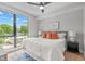 Sunny bedroom with a ceiling fan, a large window with a great view and designer decor at 615 W Peace St # 307, Raleigh, NC 27605