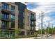 Attractive brick apartment building with a mix of balconies and large windows offering plenty of natural light at 615 W Peace St # 307, Raleigh, NC 27605