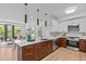 Modern kitchen with stainless steel appliances, breakfast bar, and easy access to living area at 615 W Peace St # 307, Raleigh, NC 27605