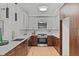 Bright and modern kitchen boasting stainless appliances, stylish cabinetry, and hardwood floors at 615 W Peace St # 307, Raleigh, NC 27605