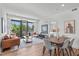 Inviting living room boasts hardwood floors, balcony access, and modern decor at 615 W Peace St # 307, Raleigh, NC 27605