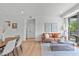 Bright living room featuring an open floor plan, modern decor, and large windows at 615 W Peace St # 307, Raleigh, NC 27605