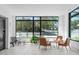 Bright lobby with comfortable seating areas, views of the street, and package locker area at 615 W Peace St # 307, Raleigh, NC 27605