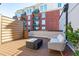 Rooftop deck with contemporary outdoor furniture and city views at 615 W Peace St # 307, Raleigh, NC 27605