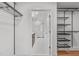 Bright walk-in closet that leads to a contemporary bath with a large tile and glass shower at 615 W Peace St # 307, Raleigh, NC 27605