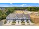 Four townhouses, new construction, and surrounding landscape at 712 Jamescroft Way # 26, Rolesville, NC 27571