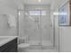 Clean bathroom with a large shower, marble tile, and a built-in bench at 712 Jamescroft Way # 26, Rolesville, NC 27571