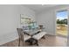 Dining area with wood table and bench seating, and view of backyard at 712 Jamescroft Way # 26, Rolesville, NC 27571