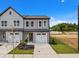 New construction townhome with a one-car garage, manicured lawn, and easy street access at 712 Jamescroft Way # 26, Rolesville, NC 27571