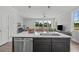 Open kitchen with island, stainless steel appliances, and view of living area at 712 Jamescroft Way # 26, Rolesville, NC 27571