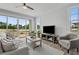 Bright living room with comfy sofas, a large TV, and sliding glass doors leading to backyard at 712 Jamescroft Way # 26, Rolesville, NC 27571