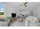 Open concept living room showcasing a modern kitchen and ample natural light at 712 Jamescroft Way # 26, Rolesville, NC 27571