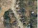 Aerial view of lot with surrounding neighborhood streets and homes at 734 Baker St, Oxford, NC 27565
