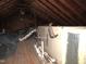 View of unfinished attic with insulation, ductwork and wooden walls at 734 Baker St, Oxford, NC 27565