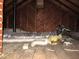 View of unfinished attic with insulation, ductwork and wood walls at 734 Baker St, Oxford, NC 27565