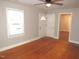 Empty living room featuring hardwood floors and natural light, ready for personalization and new memories at 734 Baker St, Oxford, NC 27565