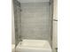 Clean bathroom shower features modern tile and fixtures, creating a fresh and stylish space at 734 Baker St, Oxford, NC 27565