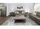 Living room with comfortable seating and a large area rug at 816 Bright Nova Way, Wendell, NC 27591