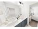 Bright bathroom featuring double vanities, a shower, and stylish tile flooring at 942 Allen Park Dr, Knightdale, NC 27604