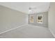 Bright bedroom with ceiling fan and two large windows at 103 Tawny Ridge Ln, Cary, NC 27513