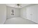 Simple bedroom with double door closet and window at 103 Tawny Ridge Ln, Cary, NC 27513