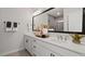 This bathroom has a double vanity with white counters and modern fixtures, with a shower-tub combo at 10519 Pleasant Branch Dr # 43, Raleigh, NC 27614