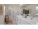 Modern bathroom with double vanity, large shower, and stylish decor at 110 Ethel Ln, Angier, NC 27501