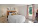 Well-lit bedroom with pink curtains and geometric wallpaper at 110 Ethel Ln, Angier, NC 27501