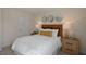 Cozy bedroom with a wicker headboard and patterned walls at 110 Ethel Ln, Angier, NC 27501