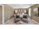 Spacious bedroom with two seating chairs and large windows at 110 Ethel Ln, Angier, NC 27501